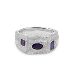 Silver ring with purple stones on a white background