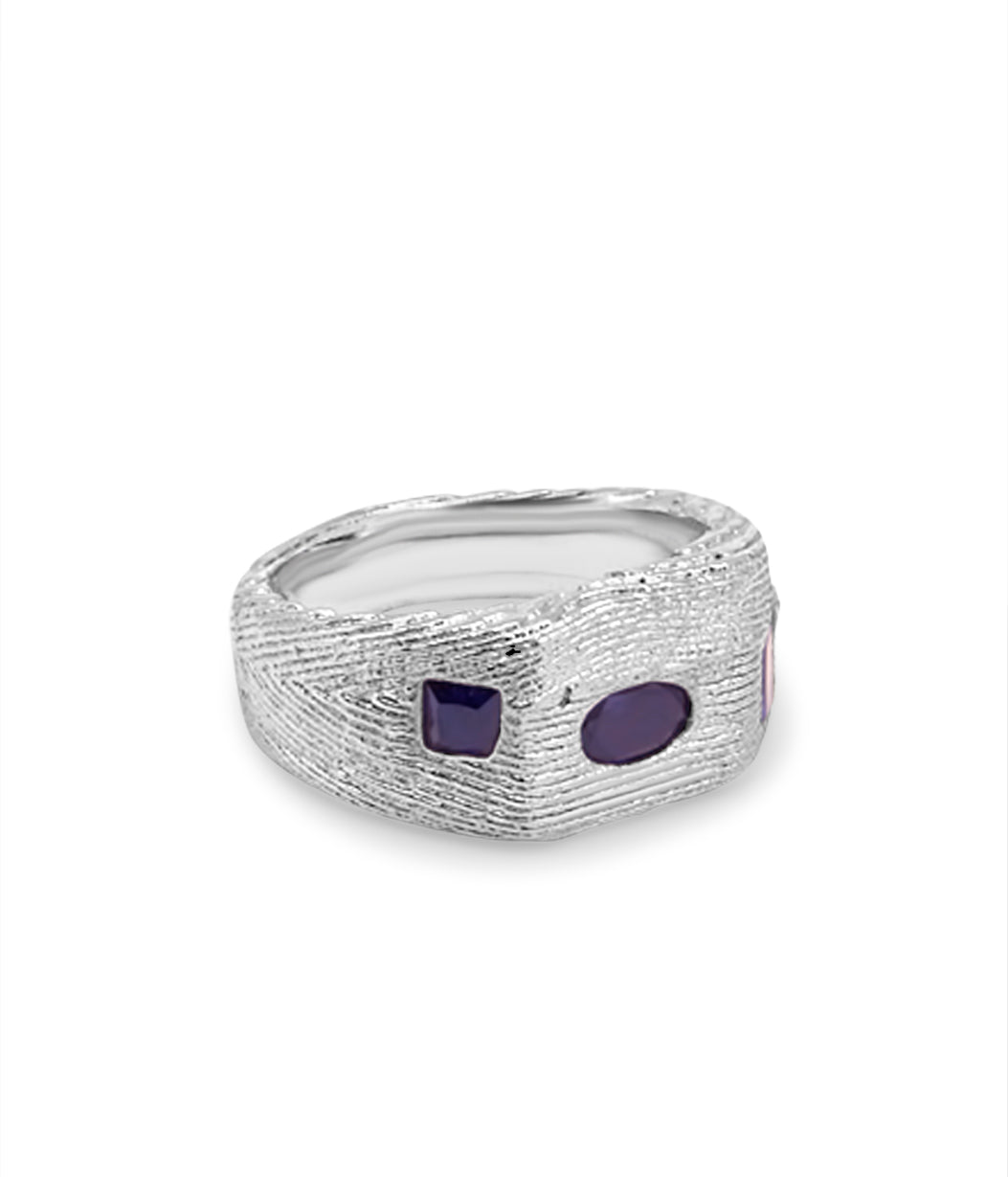 Silver ring with two purple stones on a white background