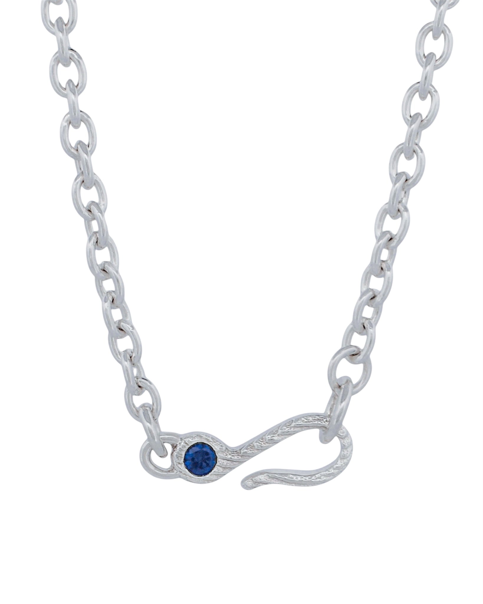 A silver chain necklace featuring a hook-shaped clasp adorned with a small round blue gemstone, shown against a plain white background.