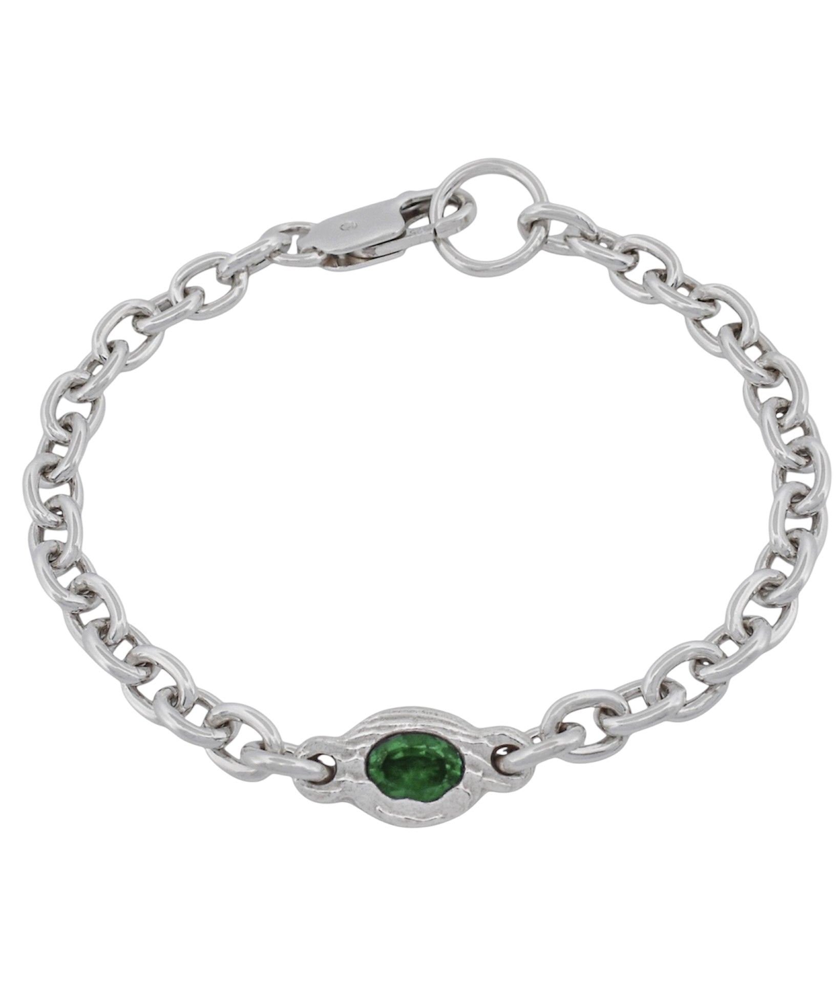 A silver chain bracelet with a central oval bezel-set green gemstone, shown on a plain white background.
