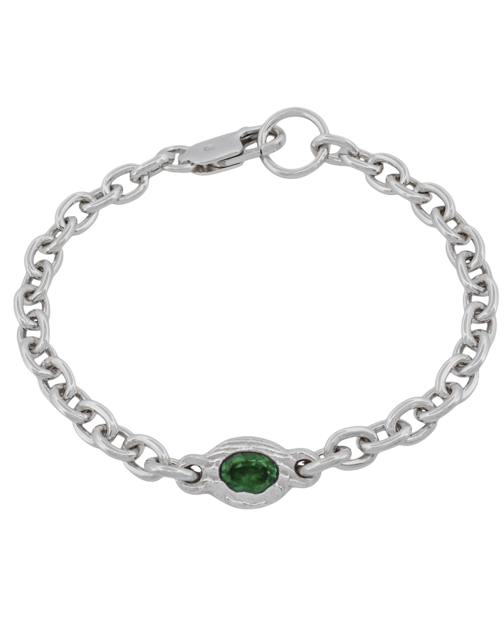 A silver chain bracelet with a central oval bezel-set green gemstone, shown on a plain white background.