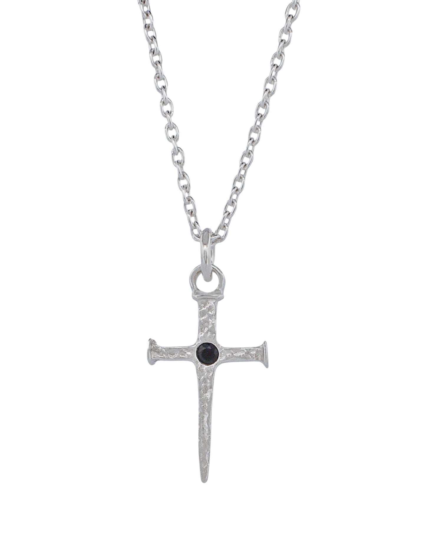 A silver cross pendant necklace with a small black gemstone at the center, suspended from a silver link chain against a plain white background.