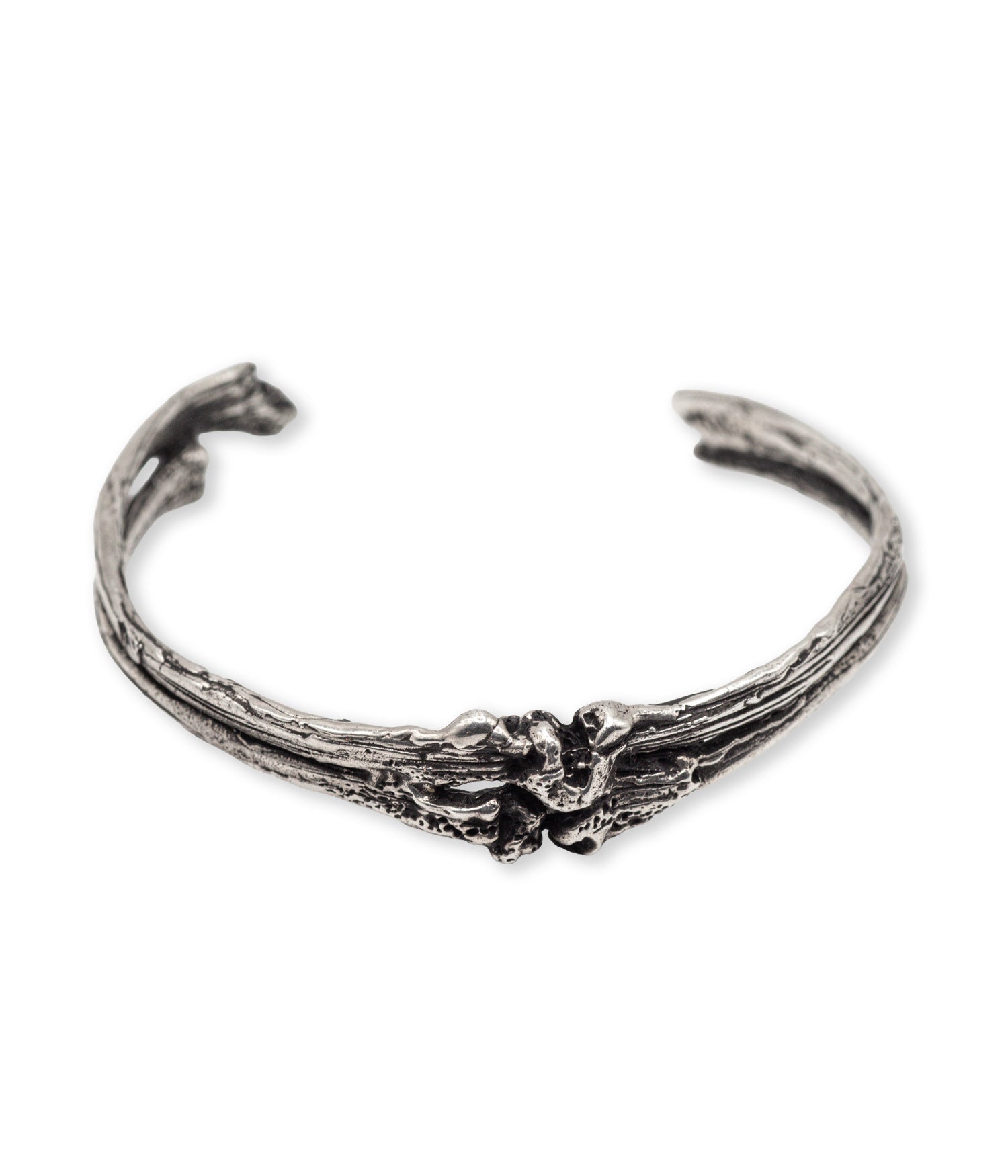 Silver bracelet with a skull design on a white background
