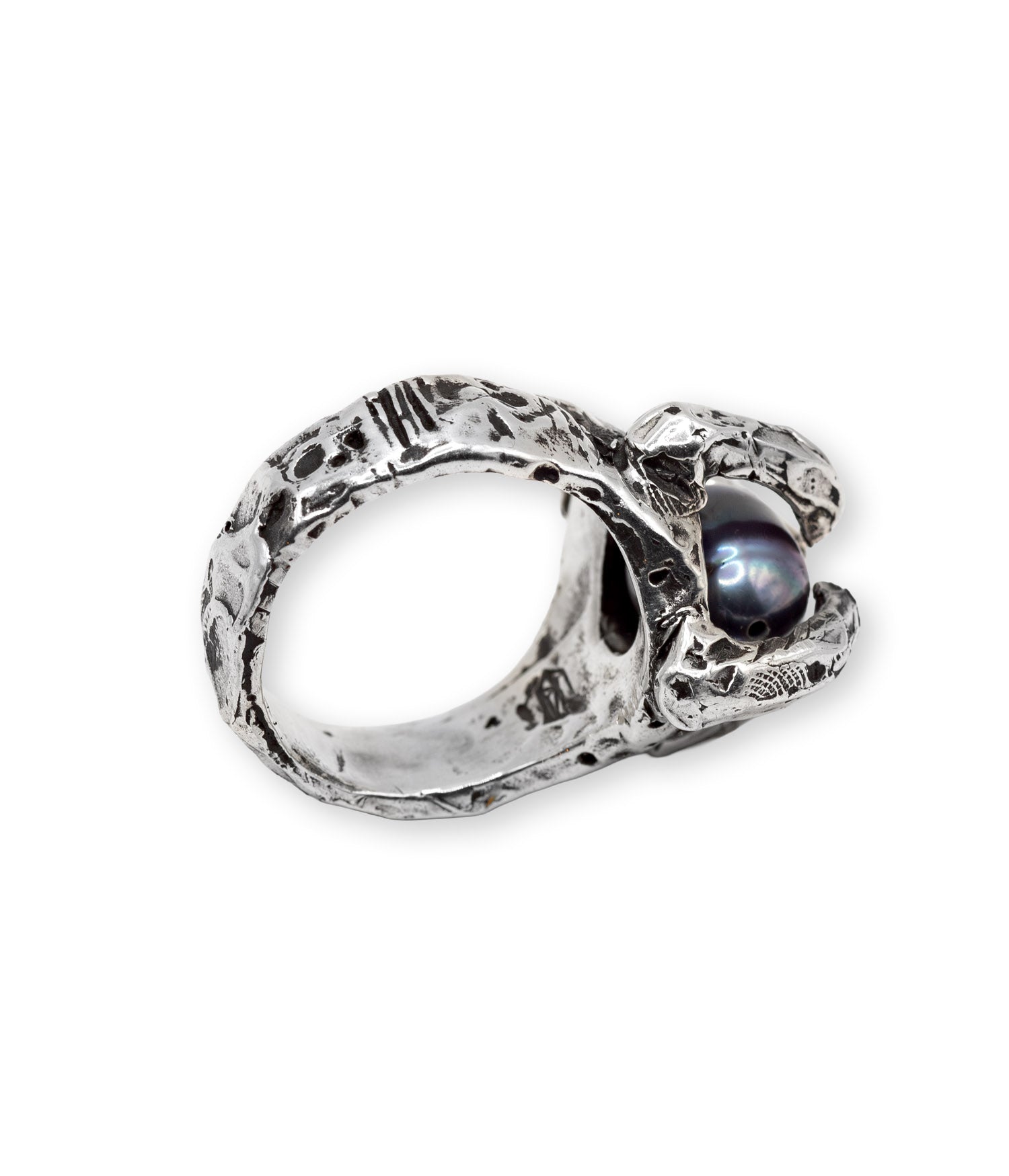 Silver ring with a central gemstone on a white background