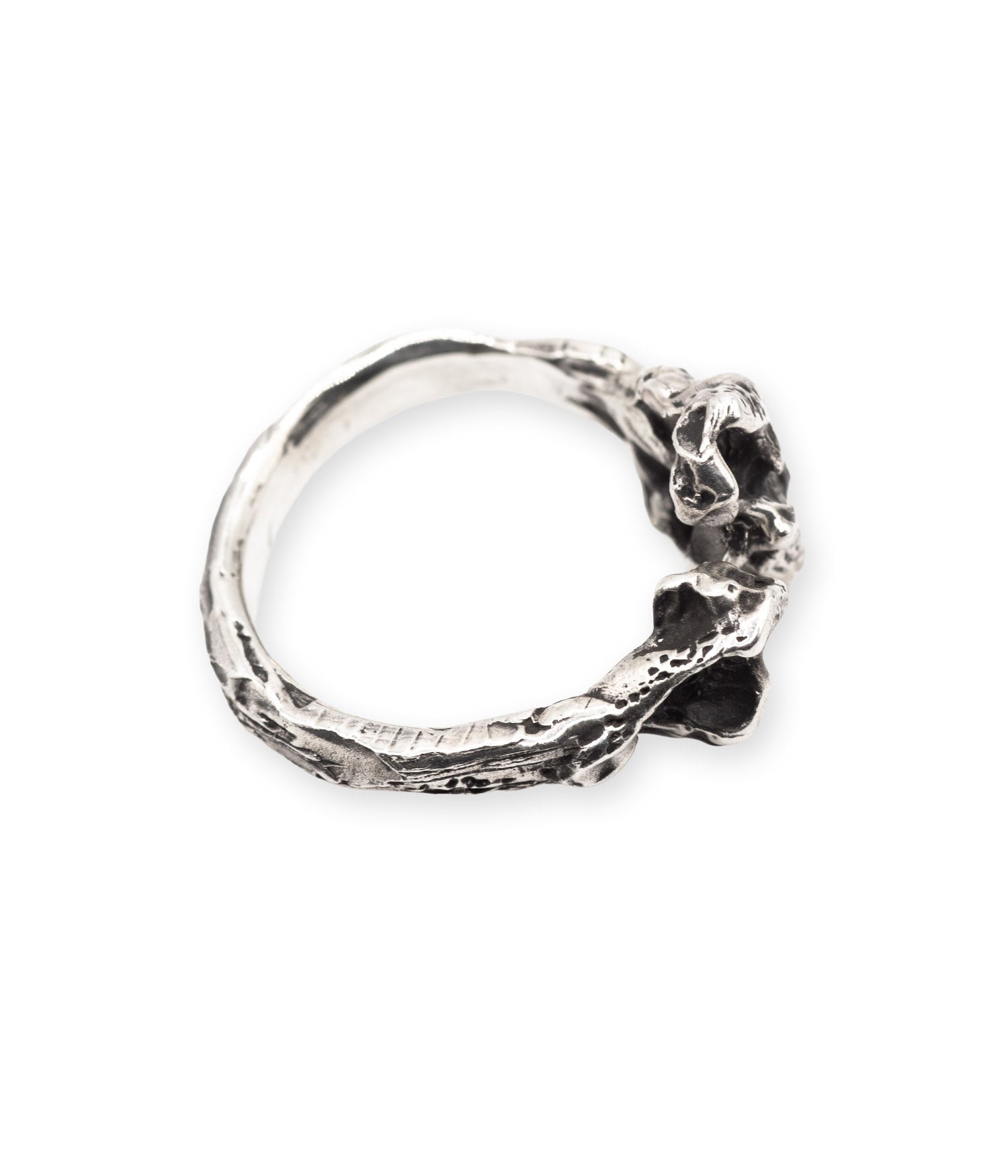 Silver ring with a textured design on a white background