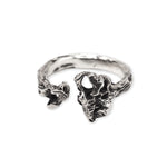 Silver openwork ring on a white background