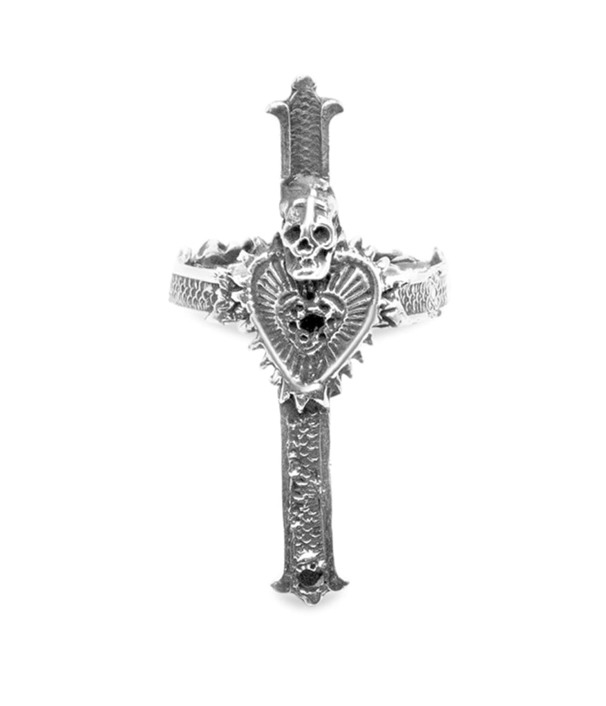 Silver cross-shaped ring with intricate designs on a white background