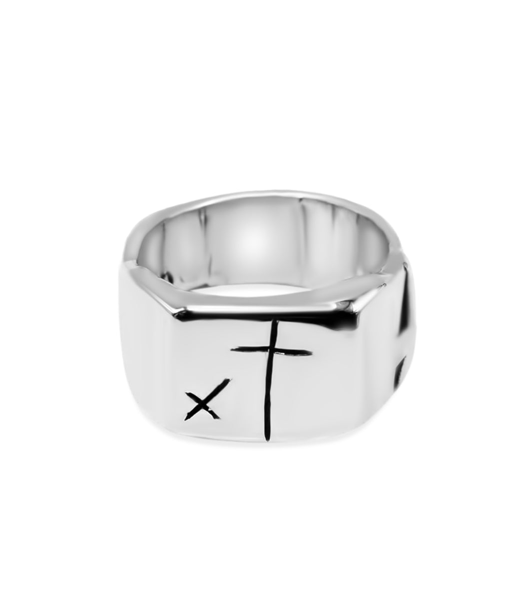 Silver ring with a black 'X' symbol on a white background