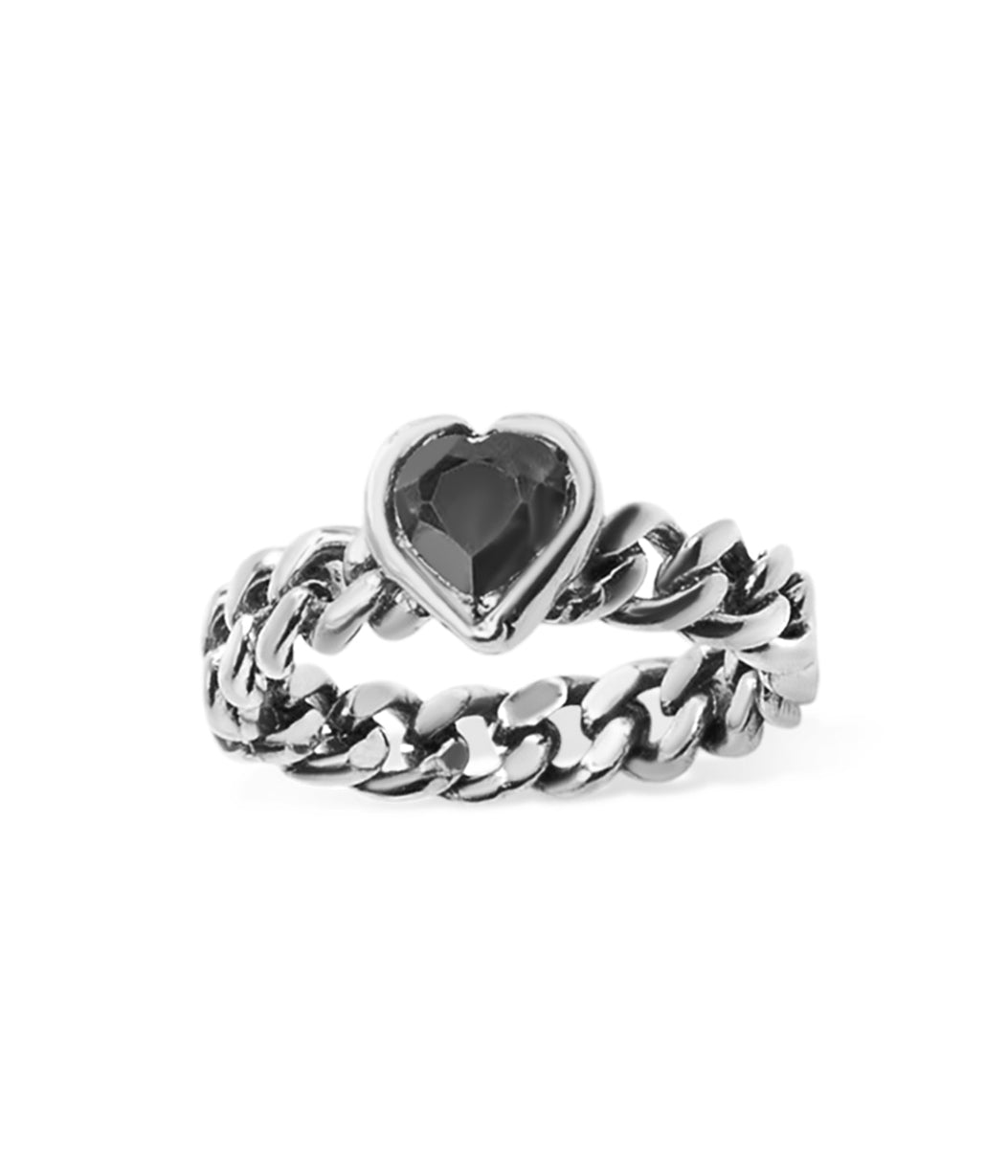 Silver chain ring with a heart-shaped gemstone on a white background