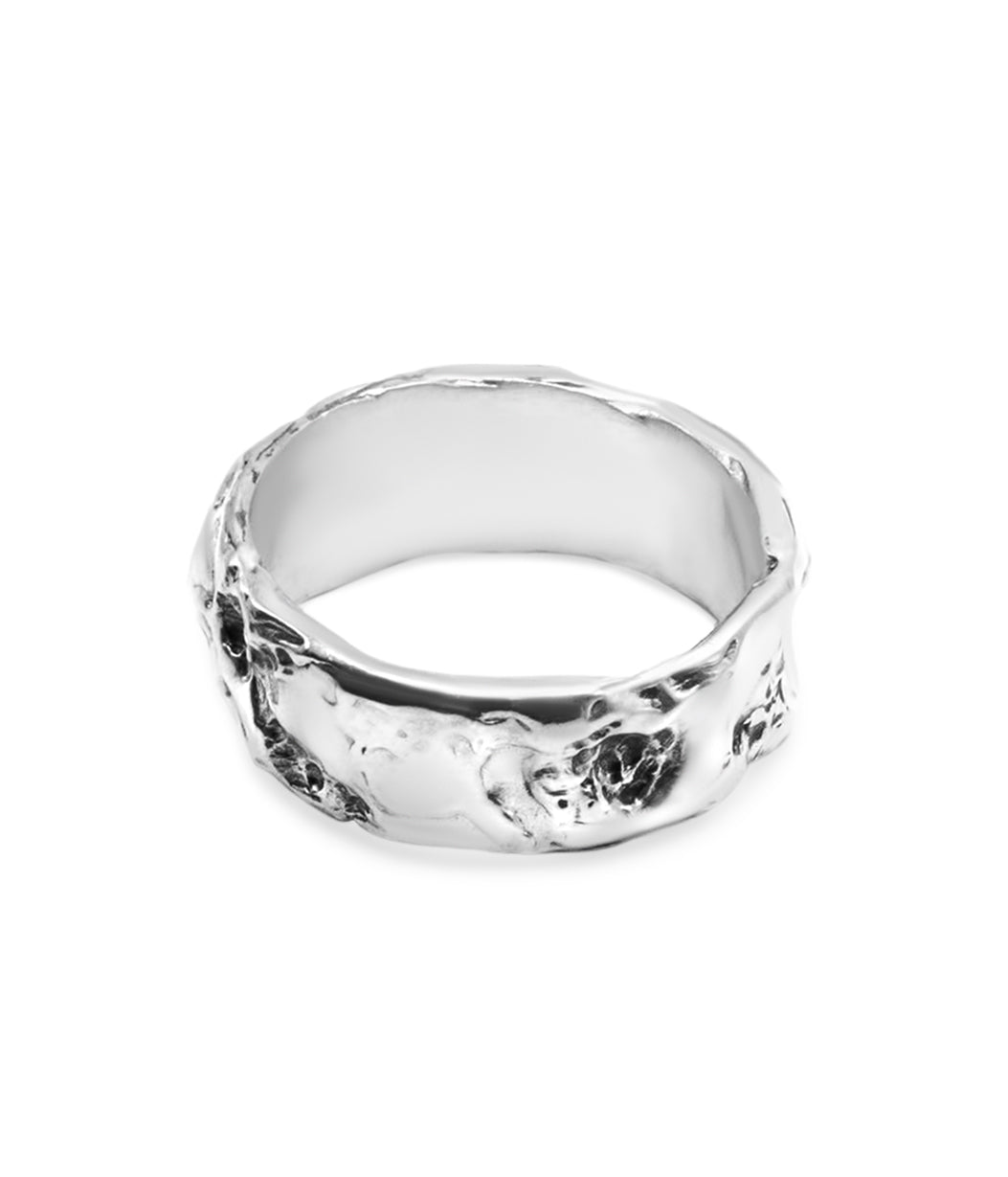 Silver ring with a textured surface on a white background