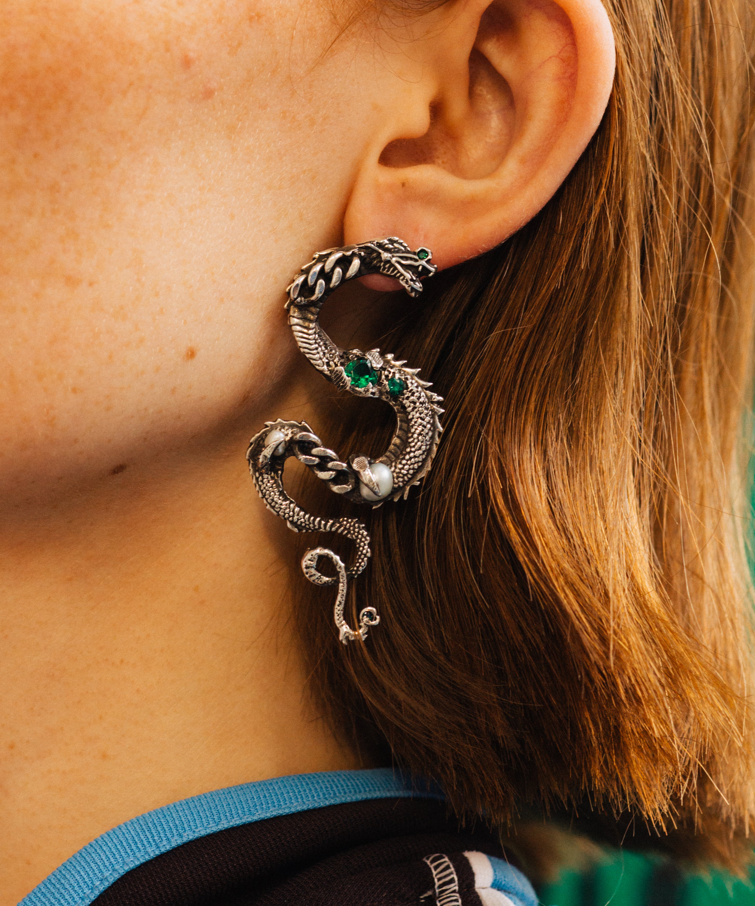Close-up of an ear with a decorative earring