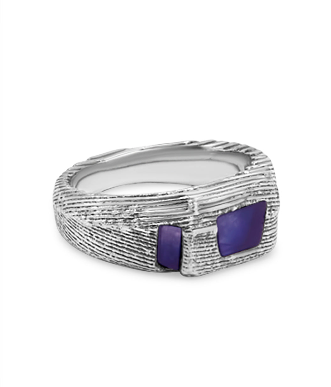 Silver ring with purple stones on a white background