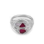 Silver ring with red gemstones on a white background