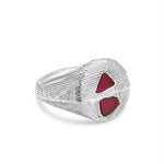 Silver ring with red stones on a white background