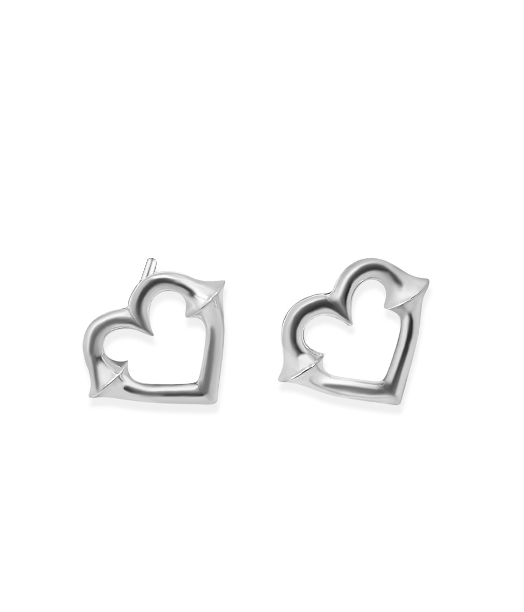 Pair of silver heart-shaped earrings on a white background