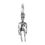 Silver skeleton pendant on a white background