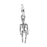 Silver skeleton charm on a white background
