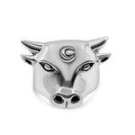 Silver bull head charm on a white background