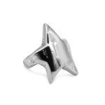 Silver star-shaped ring on a white background