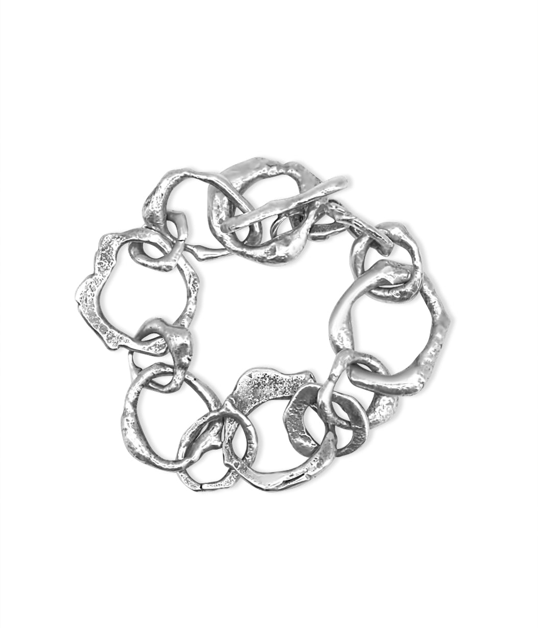 Silver bracelet with interlocking links on a white background