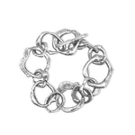 Silver bracelet with interlocking links on a white background