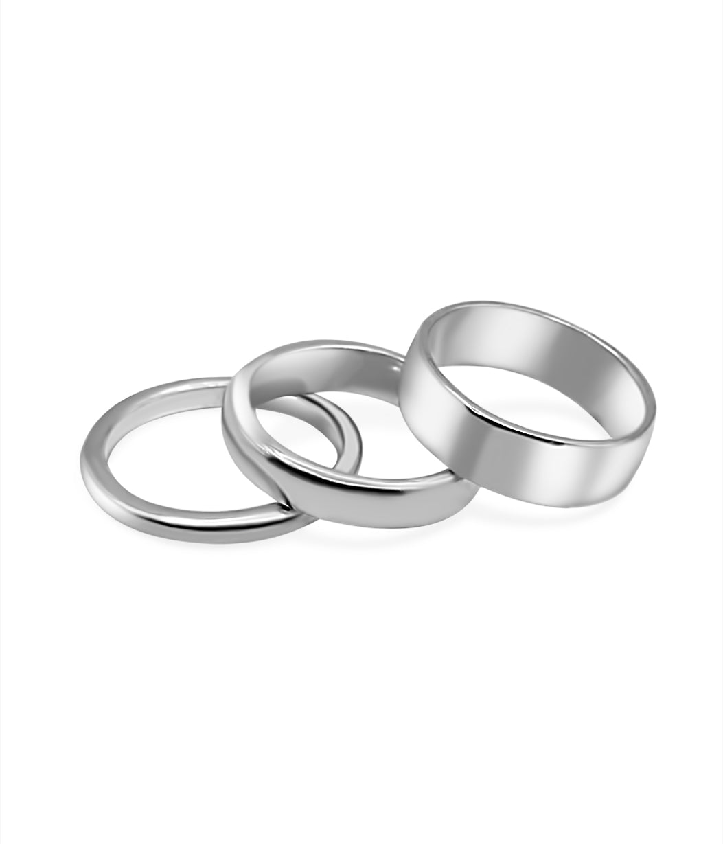 Three silver rings stacked on a white background