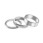 Three silver rings stacked on a white background