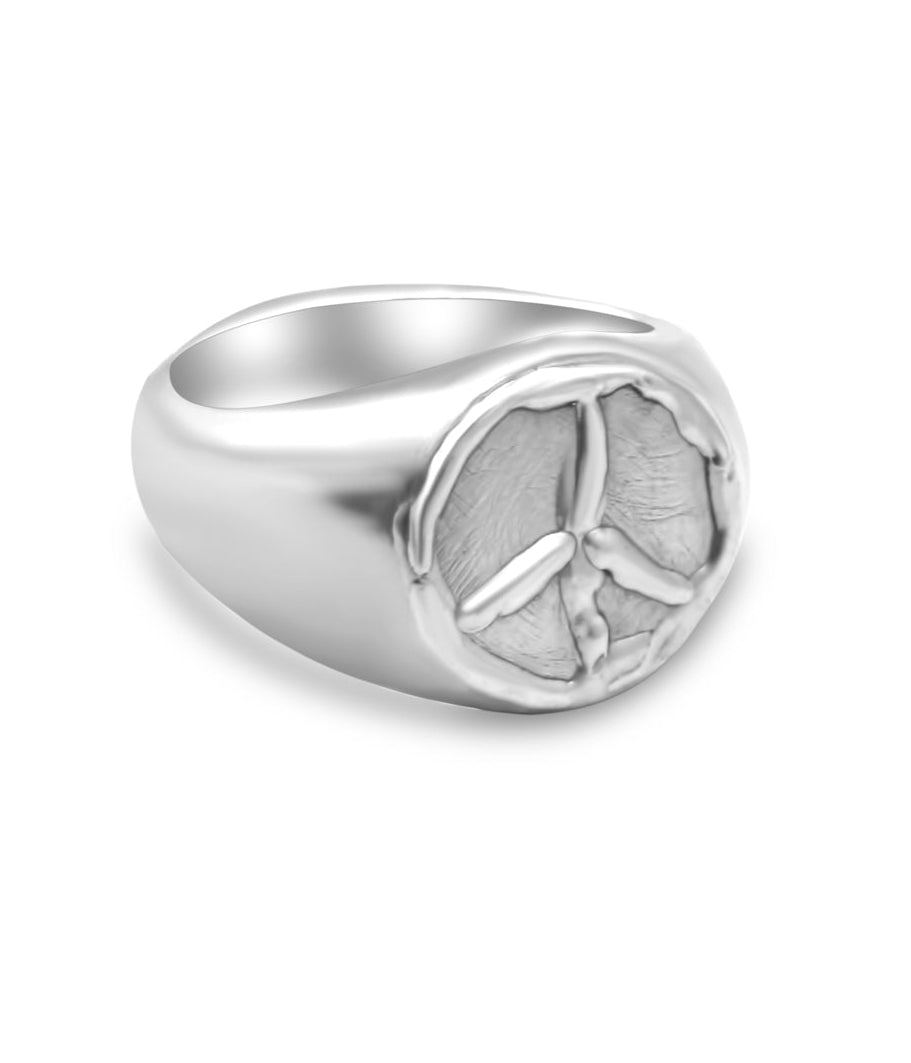 Silver ring with peace symbol on a white background