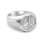 Silver ring with peace symbol on a white background