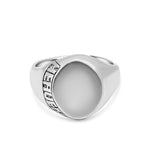 Silver ring with a textured band on a white background