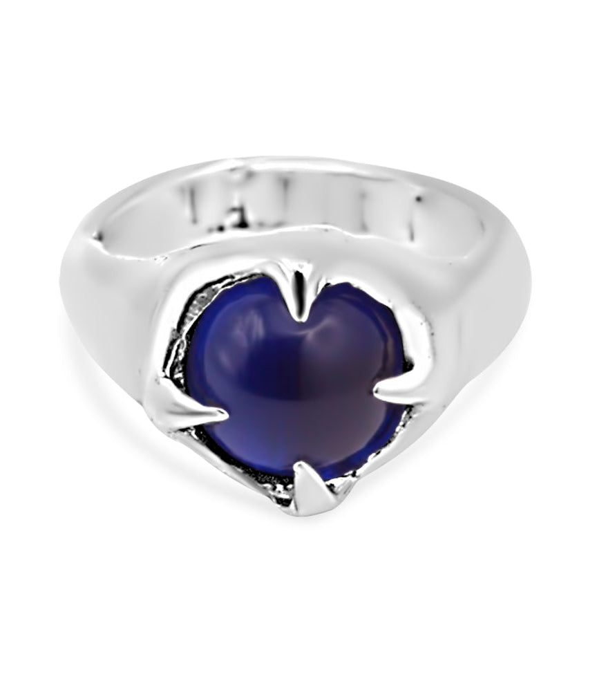 Silver ring with a blue gemstone on a white background