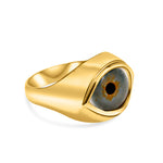 Gold ring with a gray gemstone on a white background