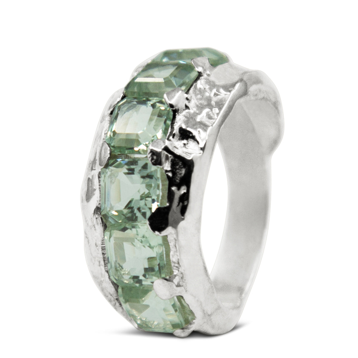 Silver ring with green gemstones on a white background