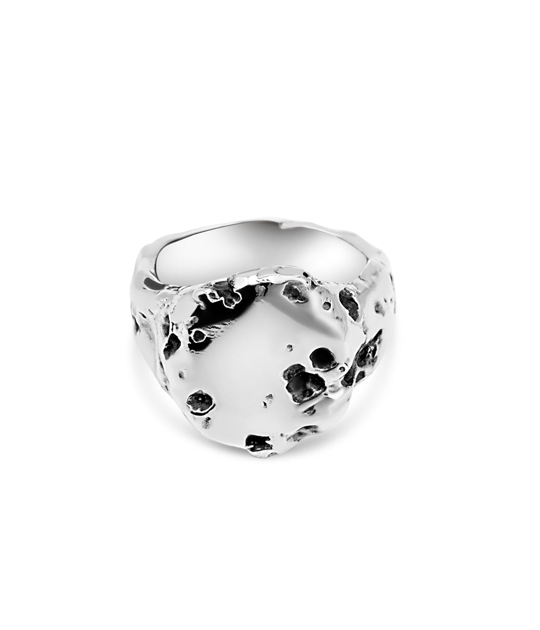 Silver ring with a textured surface on a white background