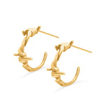 Gold hoop earrings on a white background
