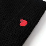 Black knit beanie with a red embroidered logo on a white background