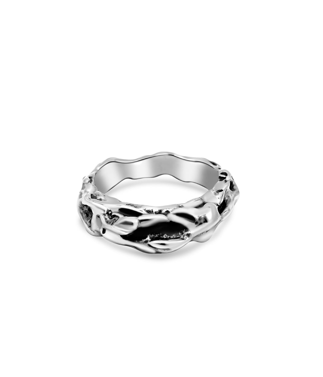 Silver ring with a unique design on a white background