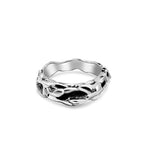 Silver ring with a unique design on a white background
