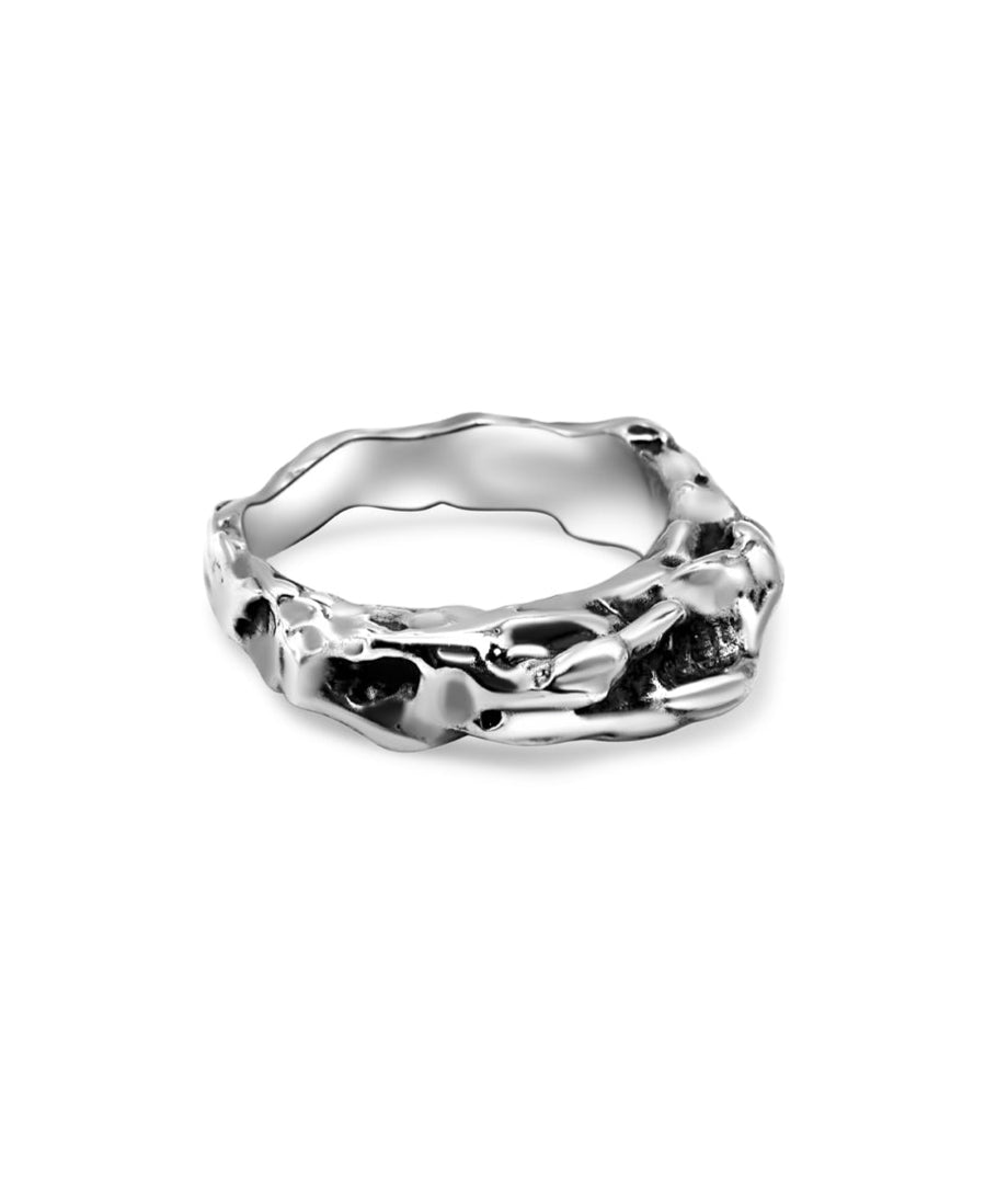 Silver ring with a textured design on a white background