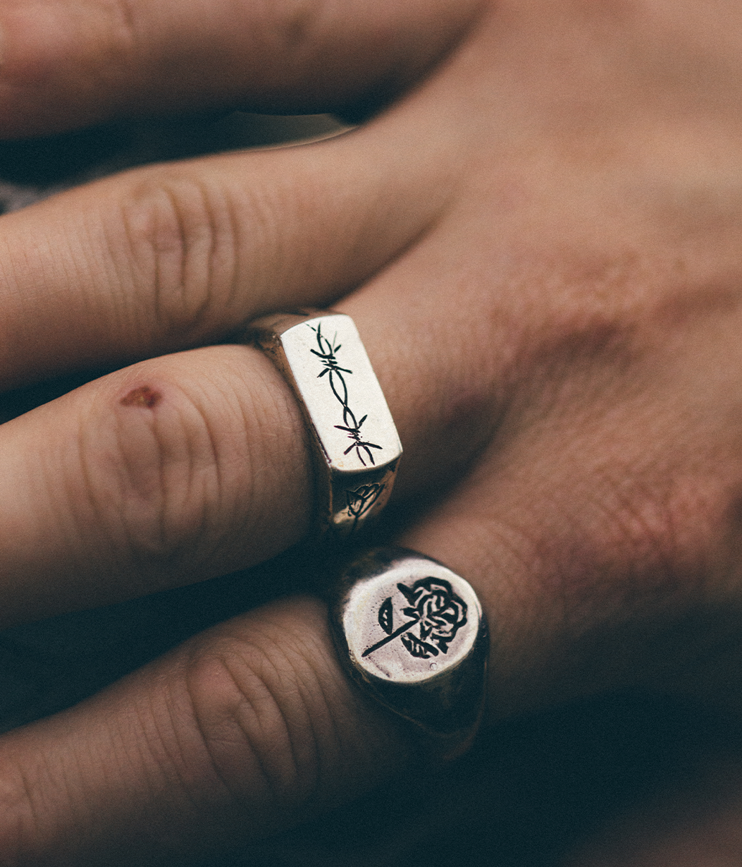 chunky silver rings on mens hand