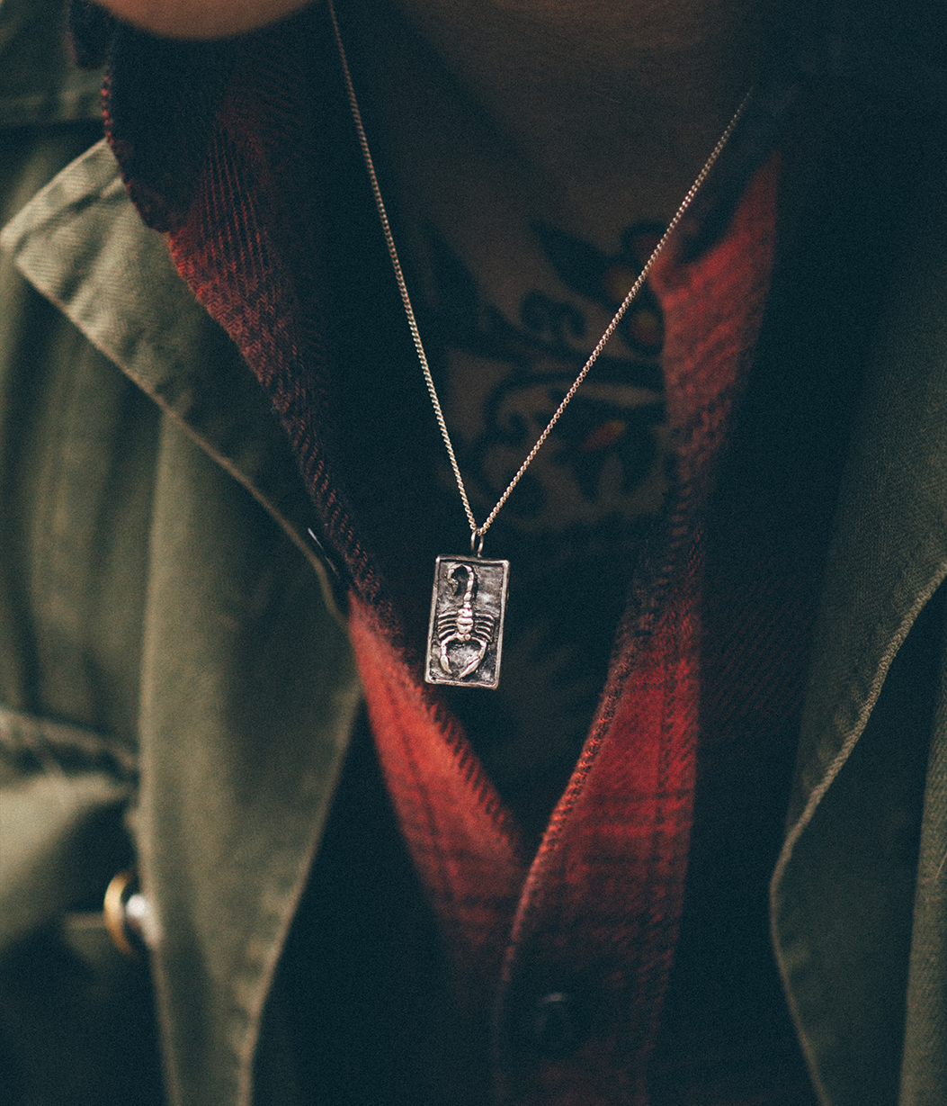 scorpion pendant necklace on model

