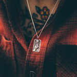 silver rose relief pendant necklace on model