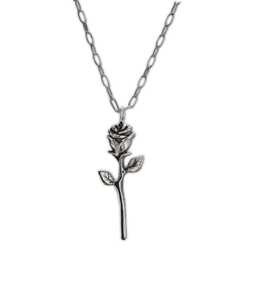 A silver rose pendant necklace on a matching silver link chain, shown against a plain white background.