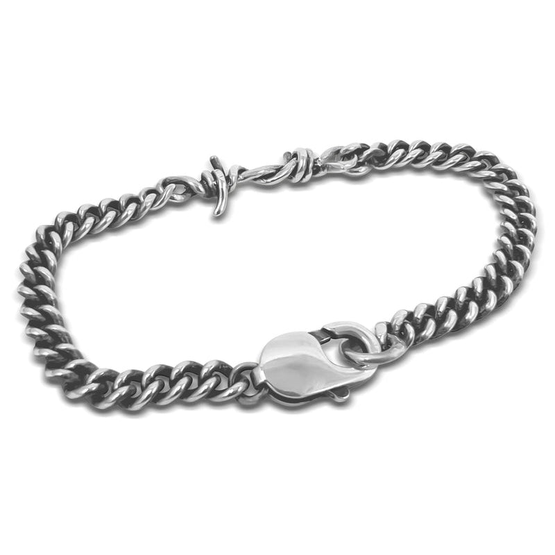 Silver chain bracelet with a clasp on a white background