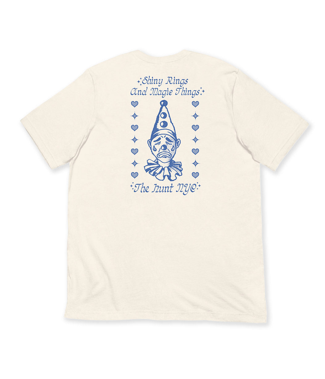 Beige t-shirt with blue graphic and text on a white background