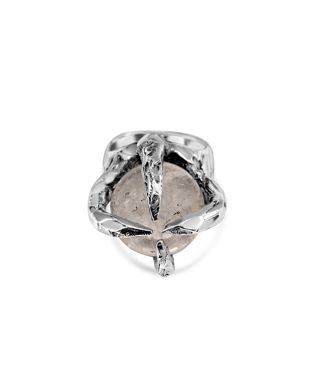 Silver ring with a clear gemstone on a white background