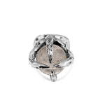 Silver ring with a clear gemstone on a white background