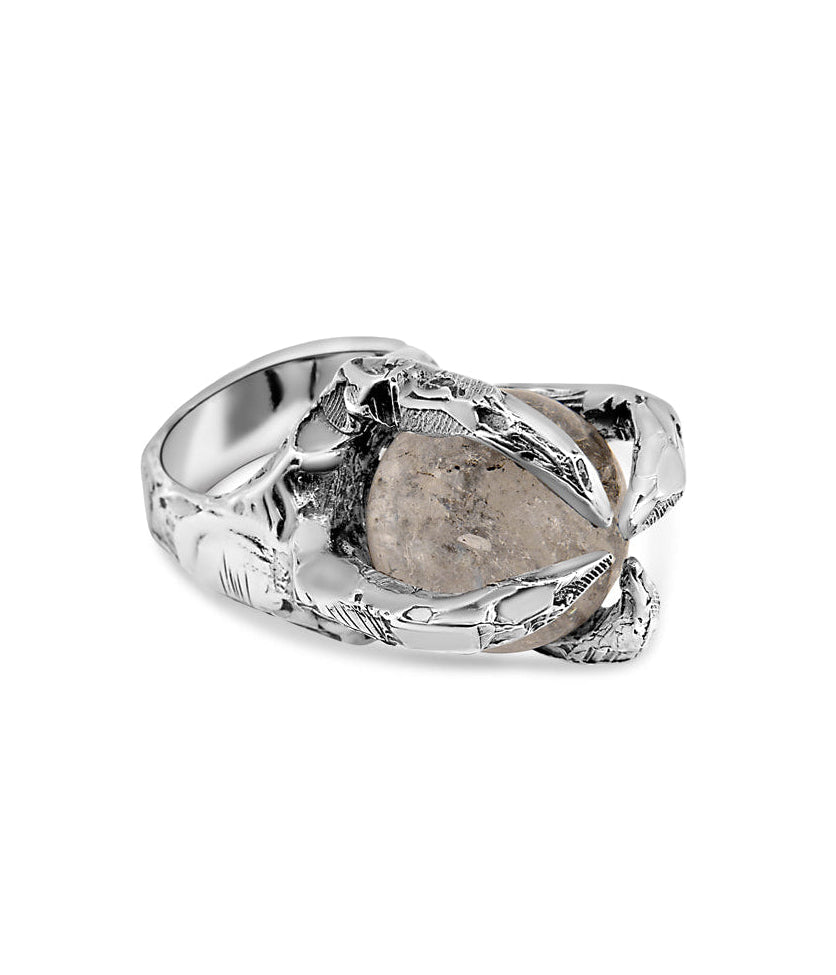 Silver ring with a large stone on a white background