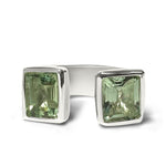 open gemstone cocktail ring with green stone 