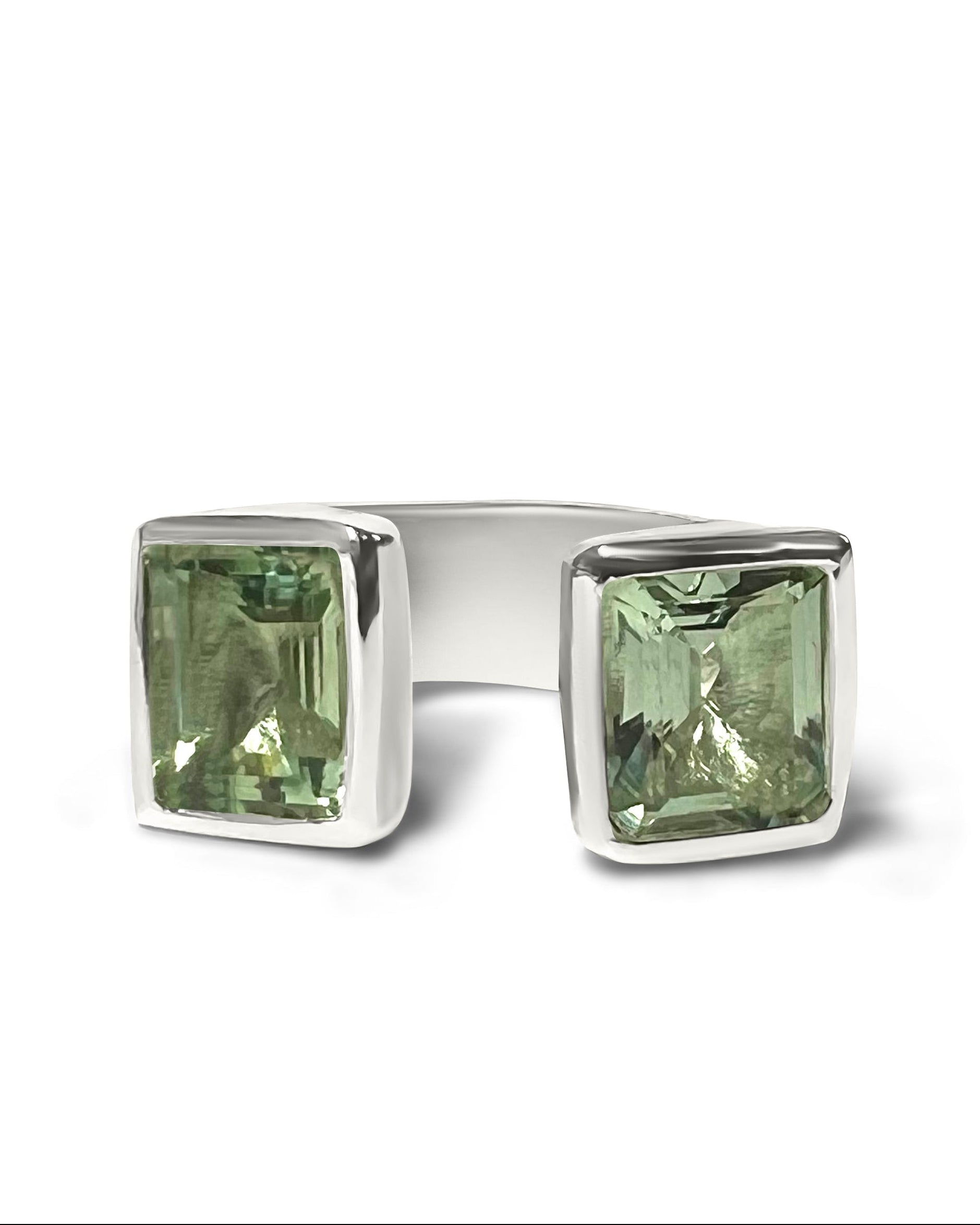 open gemstone cocktail ring with green stone 